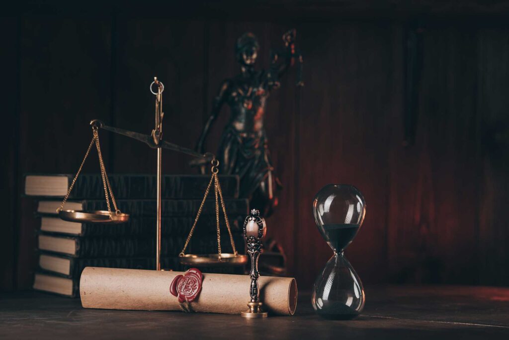 Scales of Justice and hourglass